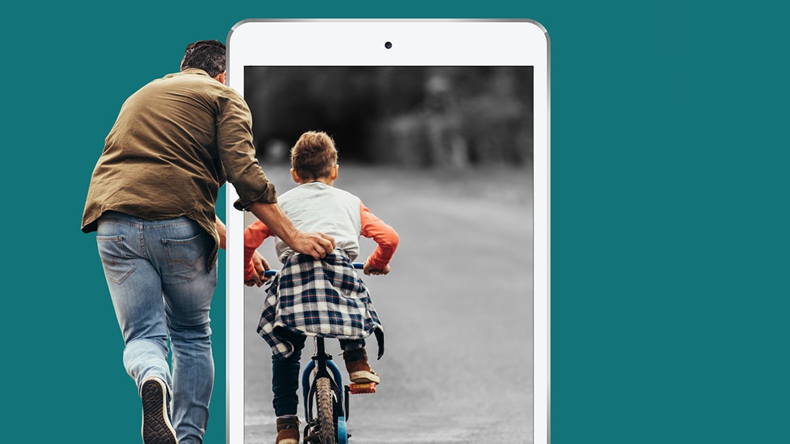 father helping son ride bike with ipad overlaid on top