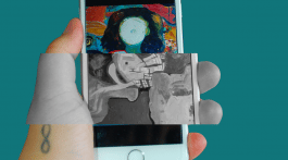 infinity tattooed hand holding phone with artistic image that conveys a faceless person